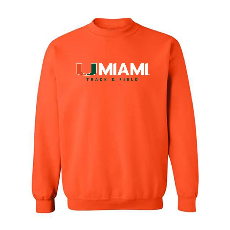 Miami - NCAA Women's Track & Field : Iyonna Codd - Classic Shersey Crewneck Sweatshirt Hoodie with Hem Patch Decorative Personalized Miami - NCAA Women's Track & Field : Iyonna Codd - Classic Shersey Crewneck Sweatshirt Hoodie with Hem Patch Decorative Personalized